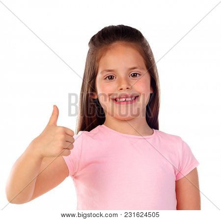 Friendly child saying Ok with her thumb isolated on a white background