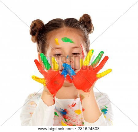 Funny girl with hands and face full of paint isolated on a white background