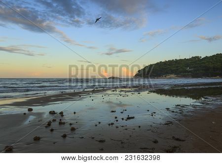 Summertime.gargano Coast:portonuovo Beach (vieste): Waves Breaking On Sandy Shoreline After Sunset. 