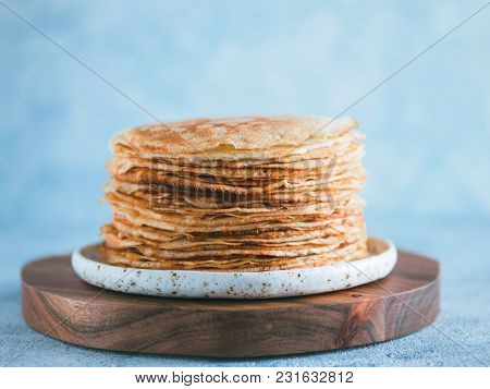 Stack Of Traditional Russian Pancakes Blini On Gray Background With Copy Space. Homemade Russian Thi