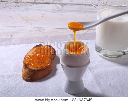 Morning Breakfast Set With Egg, Orange Jam On Bread Toast And Milk In Glass