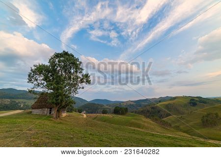 Beautiful Mountain Landscape With And Old House, Trees And A Cloudy Morning Sky, Dumesti, Salciua, A