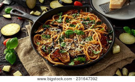 Vegetarian Italian Pasta Spaghetti Alla Norma With Eggplant, Tomatoes, Basil And Parmesan Cheese In 