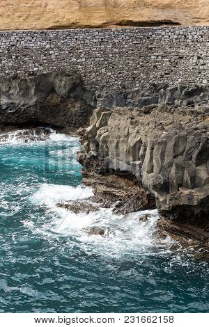 Cliff Along The Promenade In Porto Da Cruz On Madeira. Portugal