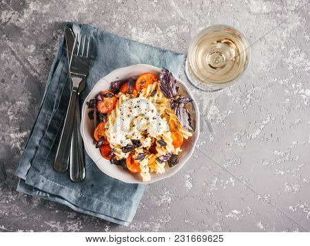 Tasty Italian Fusilli Pasta With Cherry, Mozarella Or Buratta Cheese And Fresh Basil. Dish With Past