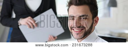 Portrait Of  Handsome Man Work At Office With Assistant