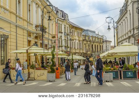 Unidentified People On Zebra Crossing And On The Terraces In Historic Center On May 12, 2016 In Crai