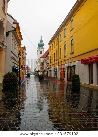Hungary, Gyor - August 31, 2014: Kazinczy Utca (street) In Gyor On A Rainy Summer-autumn Day. A Dese