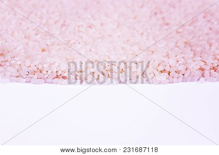 Pink Rice On A White Background, Texture And Background.