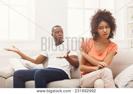 Young African-american Couple Quarreling At Home, Woman Offended. Family Relationship Difficulties C