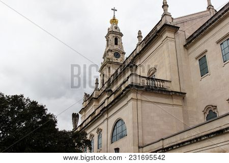The Back Of The Main Church In Fatima, Portugal. In The Fron Of The Building The Rush Of The Pilgrim