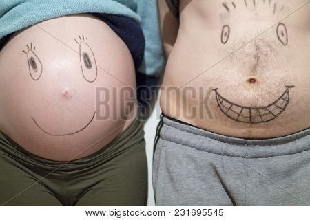 Happy And Funny Faces On A Pregnant Belly