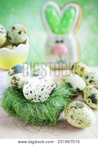 Easter Card With Quail Eggs In A Nest And A Hare In The Background