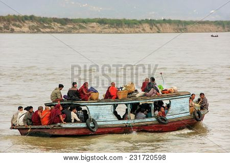 Mandalay, Myanmar - December 30: Unidentified People Ride In A Boat On Ayeyarwady River On December 