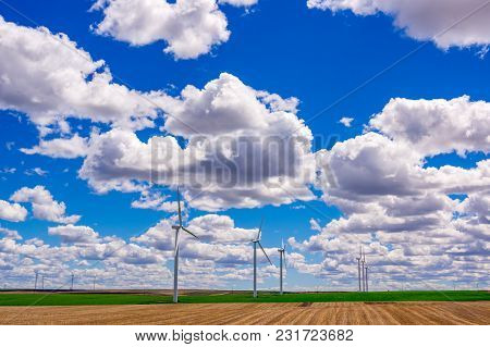 Wind Powered Electricity Generators Sitting In A Field. Located In Eastern Oregon.