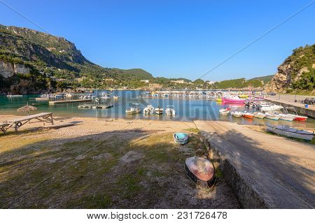 Corfu Greece - May 10, 2016: Alipa Beach In Paleokastritsa Bay With Sand And Crystal Sea Water. Corf