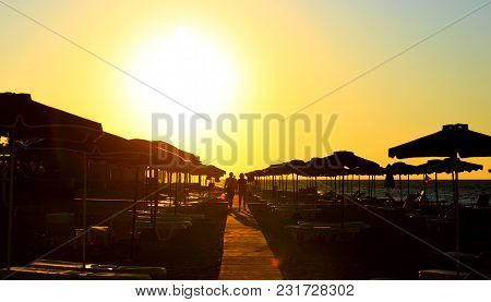 Couple In Love See Sunset At The Beac