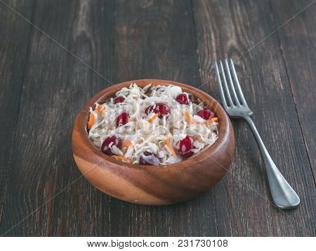 Traditional Russian Appetizer Sauerkraut With Cranberry And Carrot In Wooden Bowl On Brown Rustic Wo