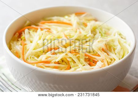 Fresh Coleslaw Salad In Bowl On Gray Stone Background.