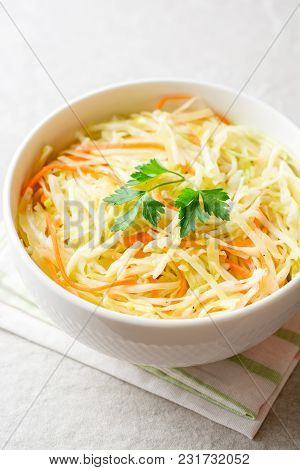 Fresh Coleslaw Salad In Bowl On Gray Stone Background.