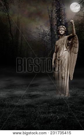A Gothic Background Of A Spooky Wood Setting With An Angel Statue.