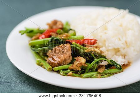 Thai Food, Stir Fried Morning Glory (pad Pak Boong) With Pork On White Dish