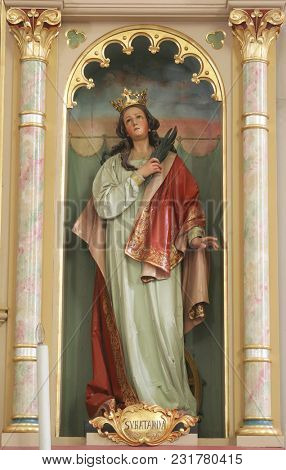 SISAK, CROATIA - DECEMBER 07: Statue of Saint Catherine of Alexandria on the altar of Our Lady in the Church of Holy Cross in Sisak, Croatia, on December 07, 2017.