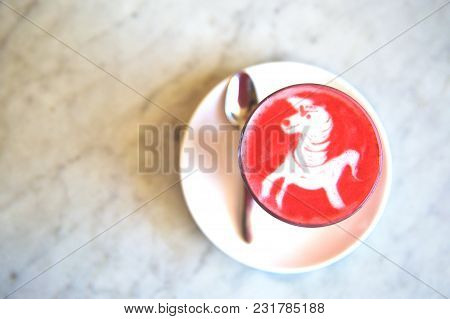 Beetroot Latte On Marble Background With Unicorn Art On The Top. Flat Lay View. Color Trendy Latte.