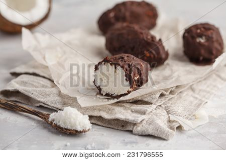 Raw Homemade Vegan Chocolate Coconut Dessert Bounty. Healthy Vegan Food Concept.