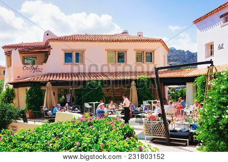 Porto Cervo, Italy - September 11, 2017: People At Street Cafe At Porto Cervo Resort, Costa Smeralda