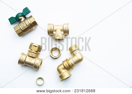 Various Plumbers Tools And Plumbing Materials Including Coper Pipe, Elbow Joint, Wrench And Spanner.