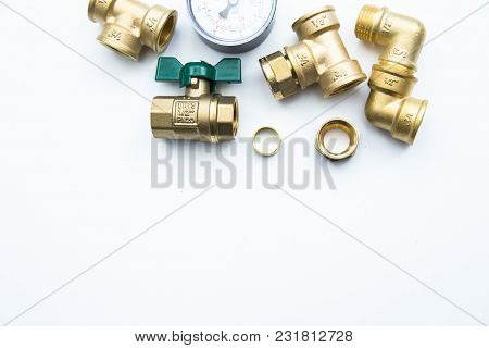 Various Plumbers Tools And Plumbing Materials Including Coper Pipe, Elbow Joint, Wrench And Spanner.