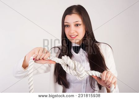 Portrait Of Pretty Student Or Businesswoman Thinking That Solve A Problem To Untie Knot Over White B
