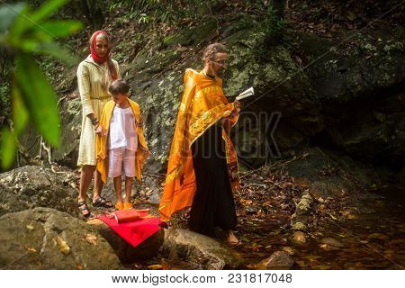 KOH CHANG, THAILAND - MAR 9, 2018: During Christian sacrament of spiritual birth - Baptism. There are currently 10 Orthodox parishes in Thailand, Orthodoxy is practiced by 0.002% of population.