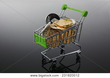 Basket From Supermarket With Coins Crypto Currency E Bitcoin Etherium Litetcoin On A Black Gray Back
