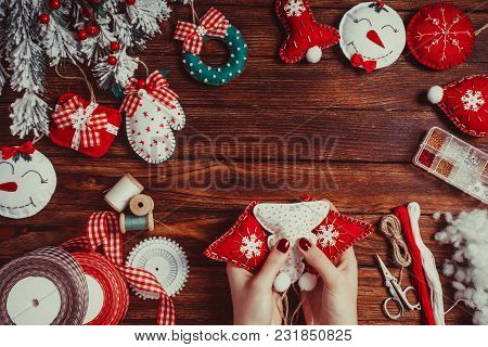 Felt Christmas Decorations On The Wooden Table - Woman Is Preparing For Handmade