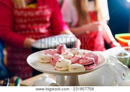 Close Up Bright Pink And White French Cookies Macarons On White Stand