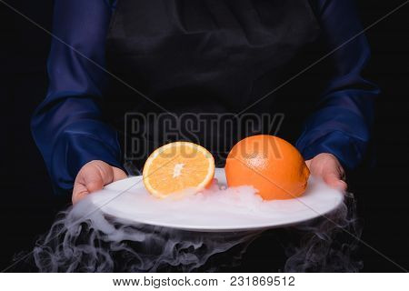Fresh Frozen Fruit In Ice. Black Background