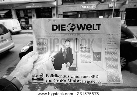 Paris, France - Mar 19, 2017: Man Reading Buying German Die Welt Newspaper At Press Kiosk Featuring 