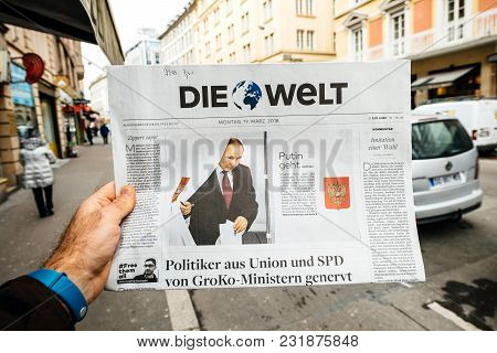 Paris, France - Mar 19, 2017: Man Reading Buying German Die Welt Newspaper At Press Kiosk Featuring 