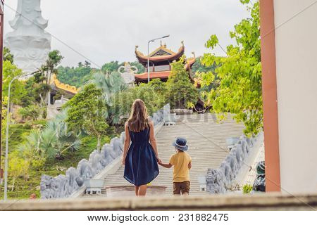 Happy Tourists Mom And Son In Pagoda. Travel To Asia Concept. Traveling With A Baby Concept.