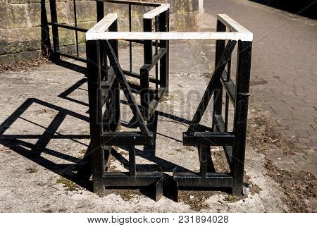 A Metal Bike Gate On The Towpath Along The Canal