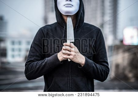 Mystery Man In White Mask Putting Knife On His Throat Considering Suicide. Depression Self Destructi
