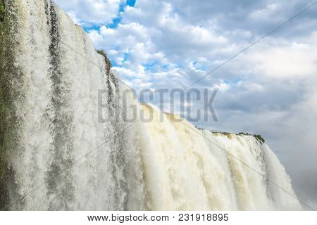 Tourists At Iguassu Falls At Iguassu National Park, World Natural Heritage Site By Unesco