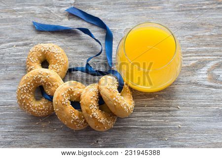 Traditional Greek Easter Biscuits Paskhalina Kuluria With Sesame Seeds On A Wooden Table, Selective 