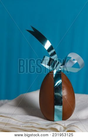 Delicious Seasonal Chocolate Easter Egg With A Ribbon