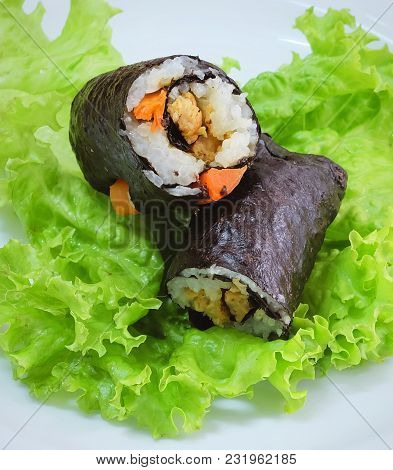 Japanese Cuisine, Traditional Vagetarian Japanese Rice Maki Sushi Roll Stuff With Tofu And Carrot Wr
