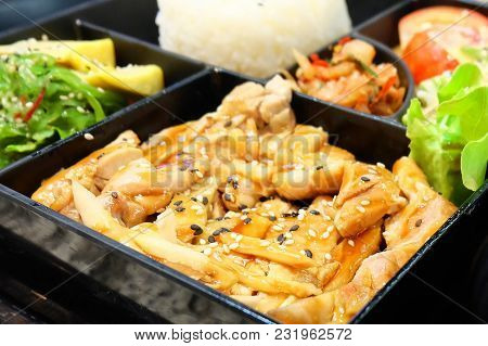 Traditional Japan Cuisine, Bento Box Or Multi-layered Box With Teriyaki Chicken Rice, Salad, Tamagoy