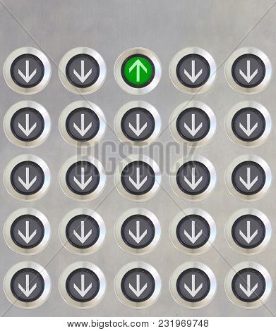 Elevator Button In Different Direction But Only On Button In Green Light Point Up On Stanless Plate.