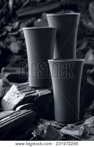 Three Matte Black Shot Glass .on Charcoal Background. Black Edition.creative.let's Drink.cheers.mock